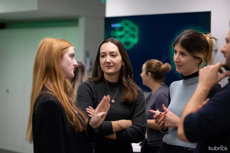 Three women talking to each other in business environment