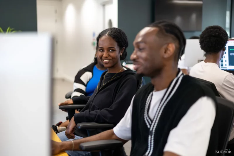 Kubrick interns looking at a screen together