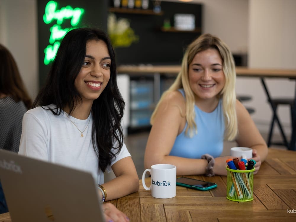 Coworkers coffee with laptop