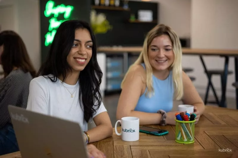 Coworkers coffee with laptop