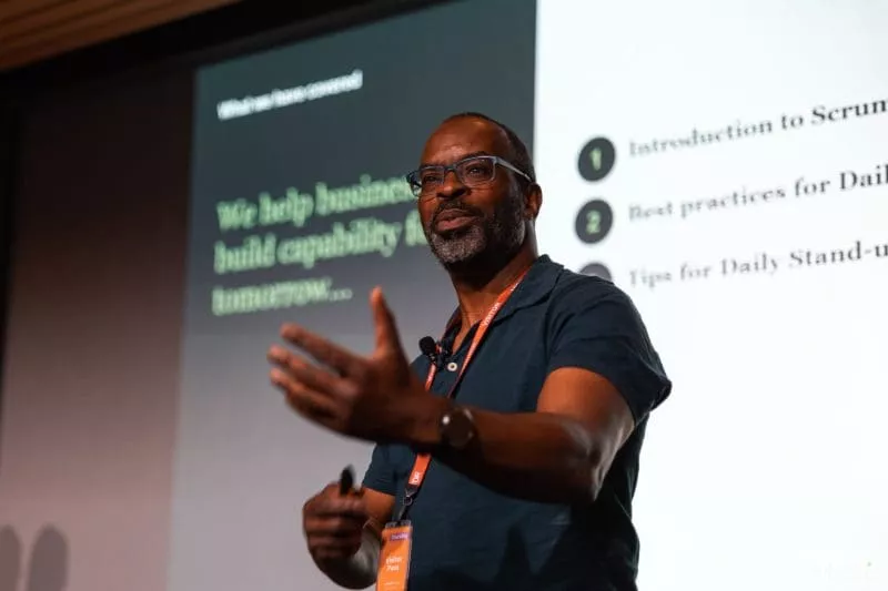 Jason presenting with screen behind him