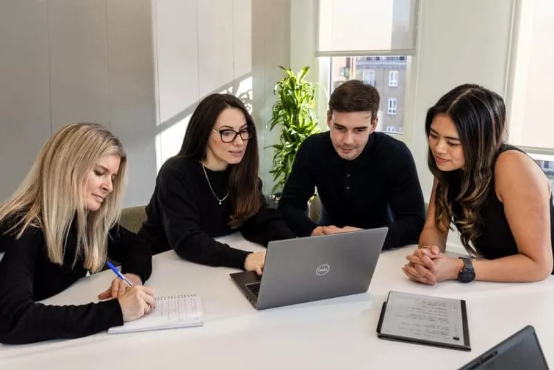 Group working on laptop together