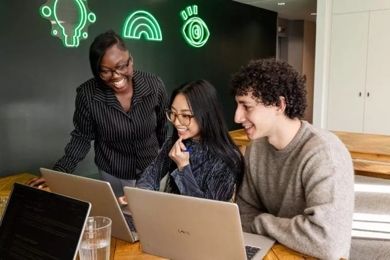 Colleagues working together in communal space