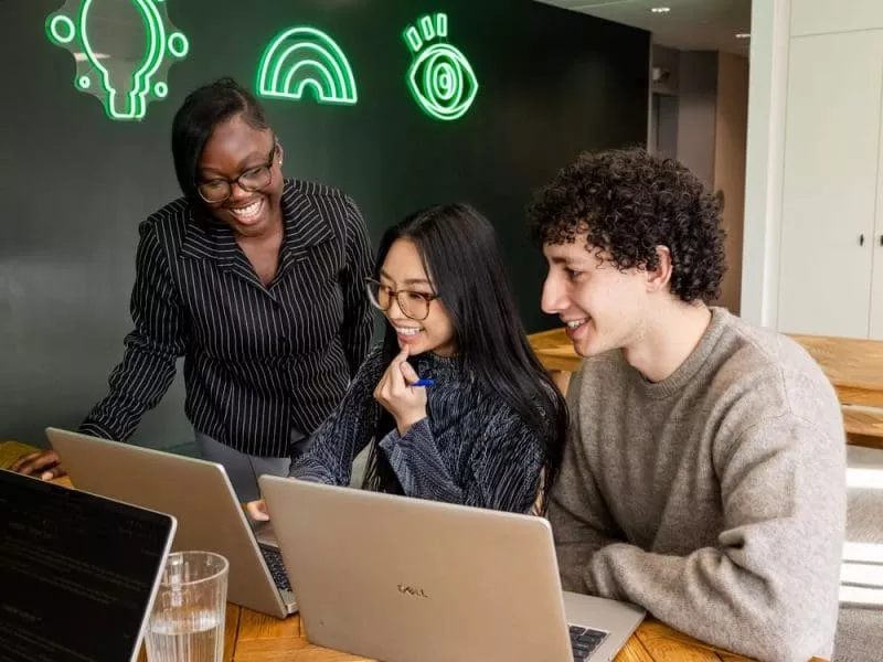 Colleagues working together in communal space