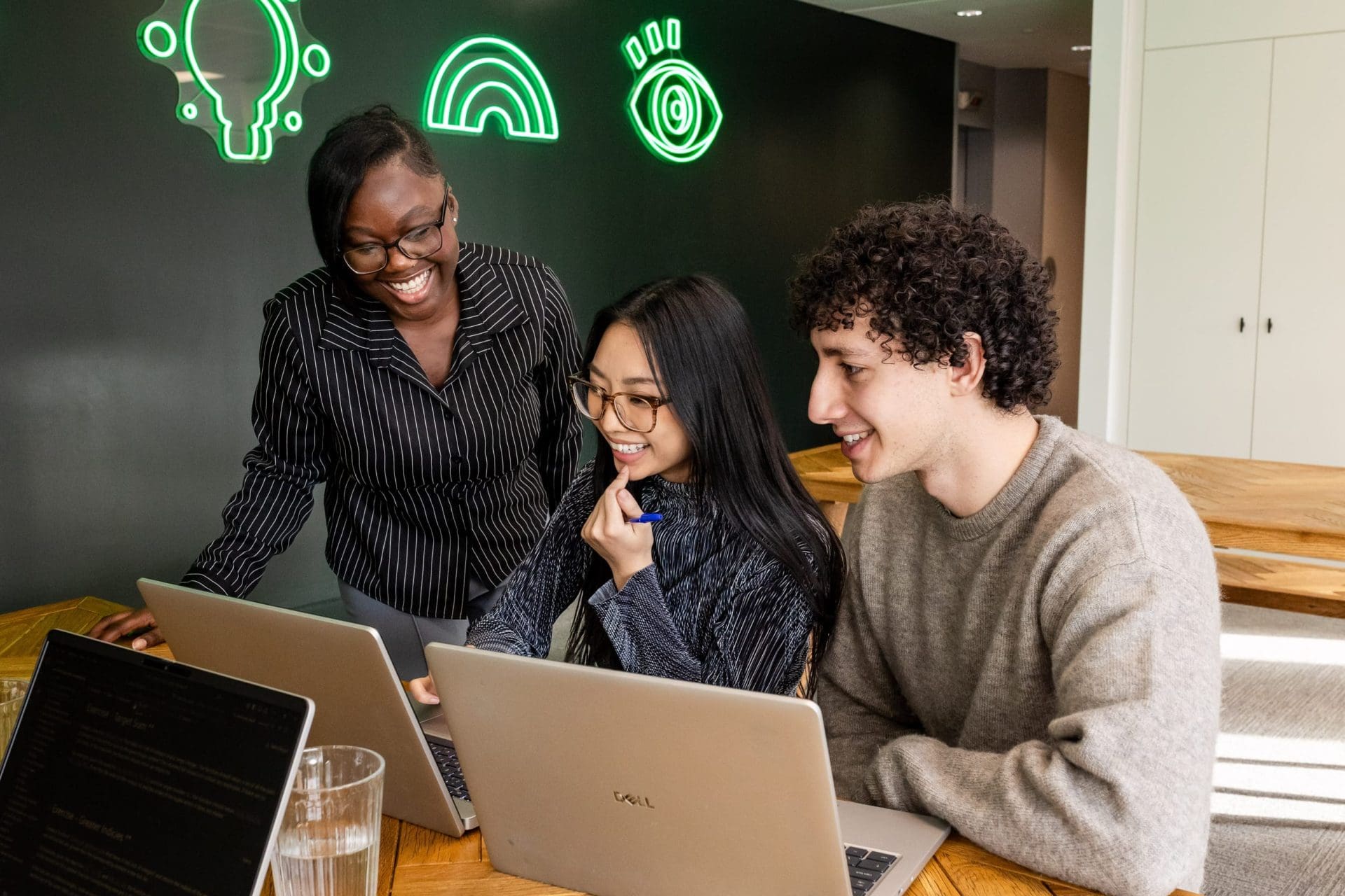 Colleagues working together in communal space